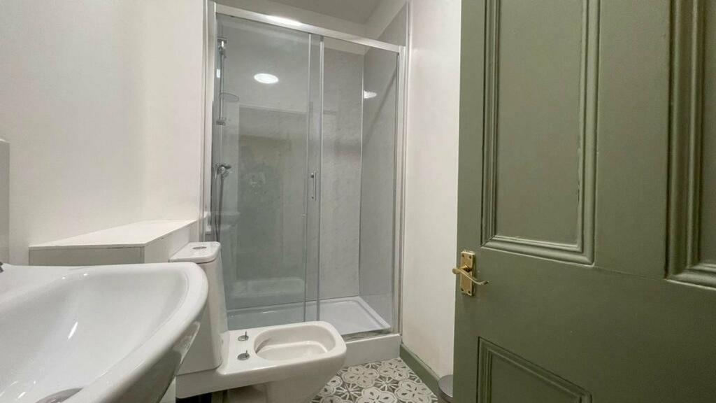 A clean and modern bathroom featuring a spaciou...