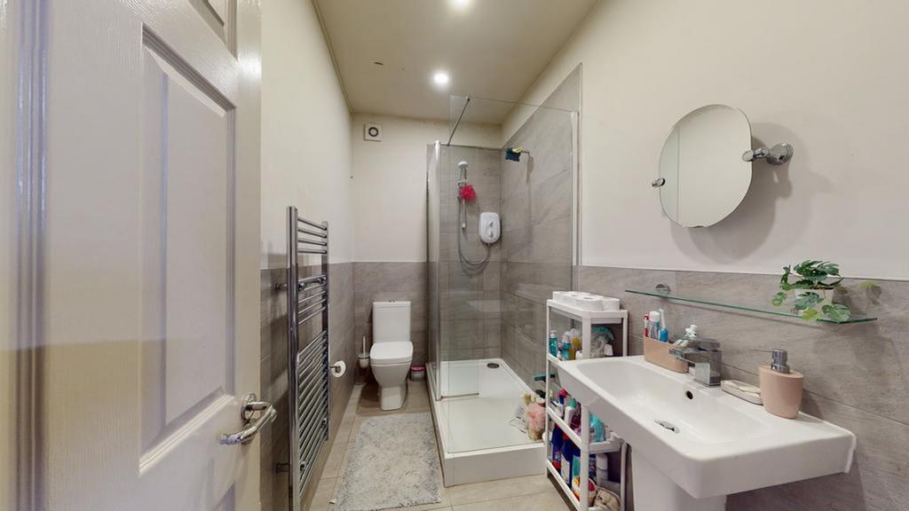 A bright and clean bathroom featuring modern fi...
