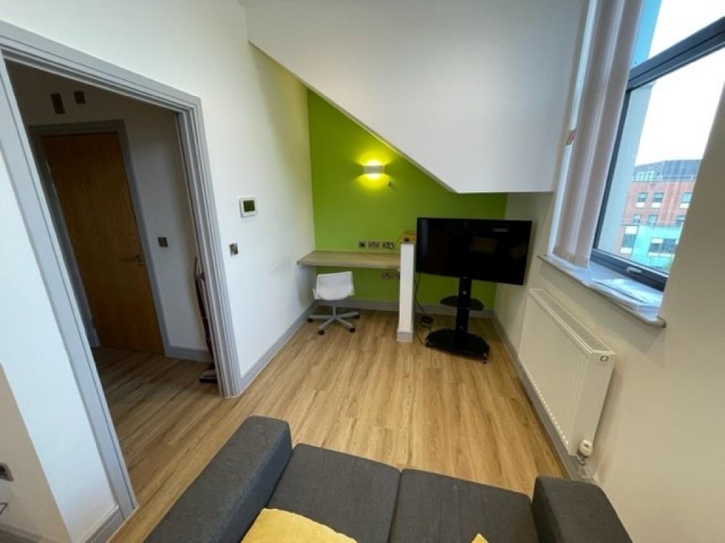 A bright and clean communal lounge featuring mo...