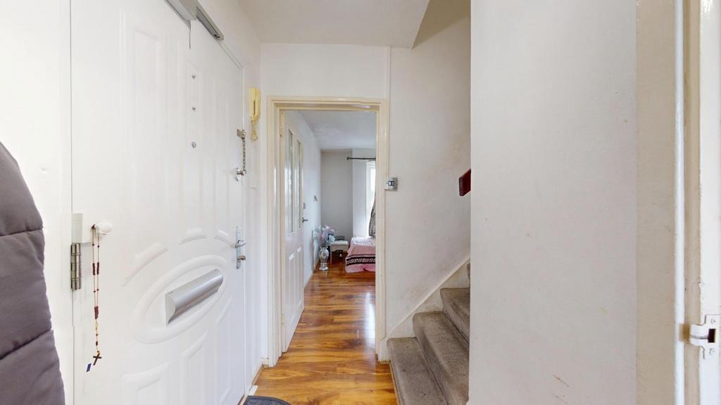 A clean and well-maintained hallway featuring p...