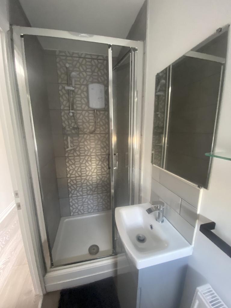 A modern and clean bathroom featuring a stylish...
