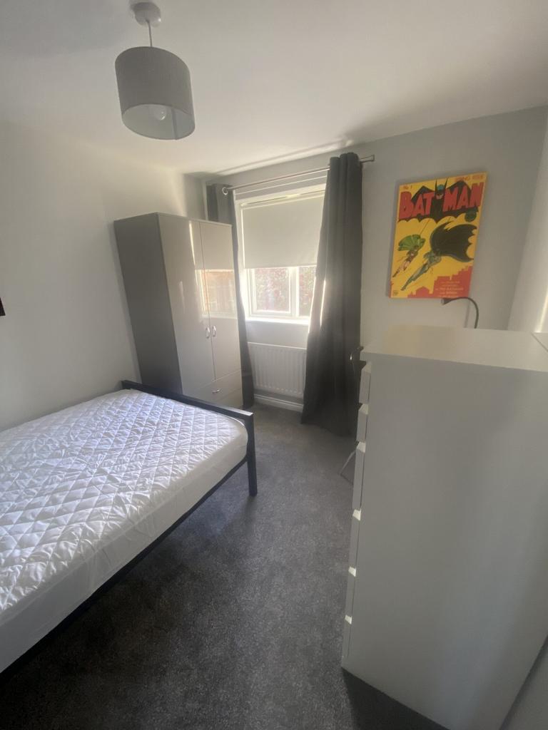 A bright and inviting double bedroom featuring ...