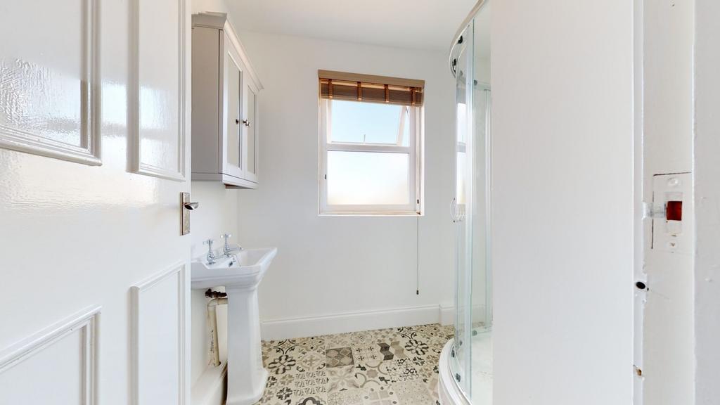 A bright and modern bathroom featuring a stylis...