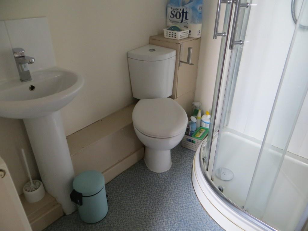 A clean and functional bathroom featuring a cur...