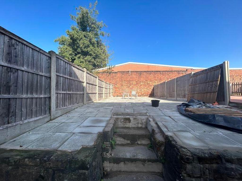A spacious and well-lit garden area, perfect fo...