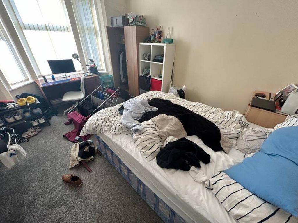 A cozy double bedroom with ample natural light,...