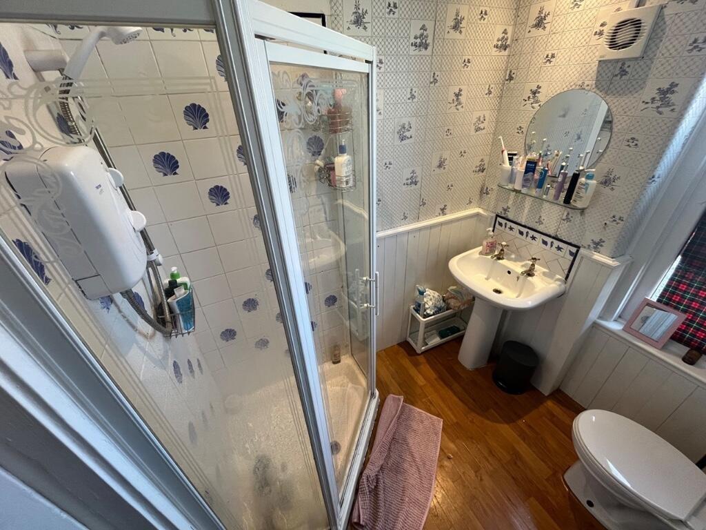 Bright and functional bathroom suite featuring ...