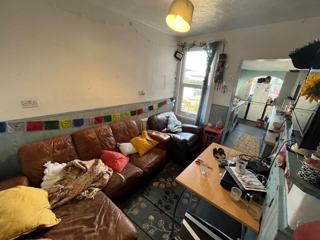 Cozy living room with a comfortable brown leath...