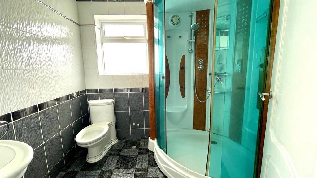 Tiled 3 piece shower room