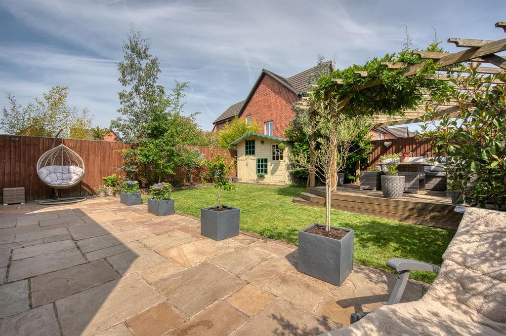 Rear Garden - patio and lawn to play house.jpg