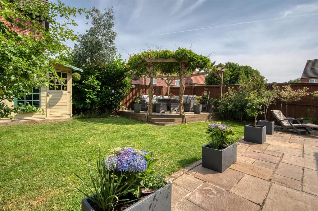 Rear Garden - lawn and seating area.jpg