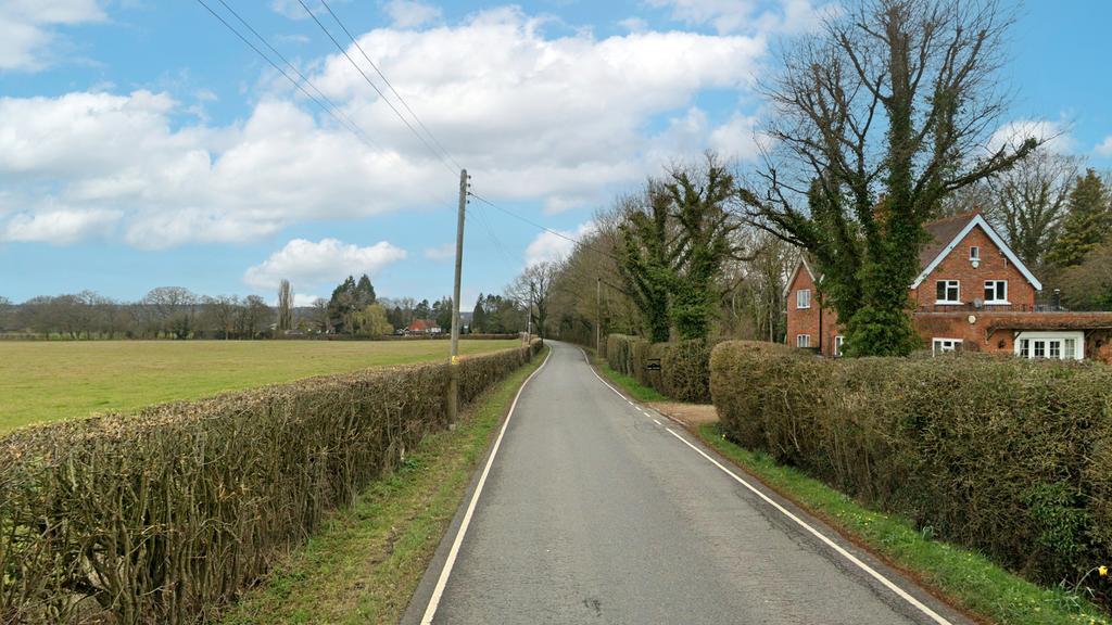 On an affluent residential road.