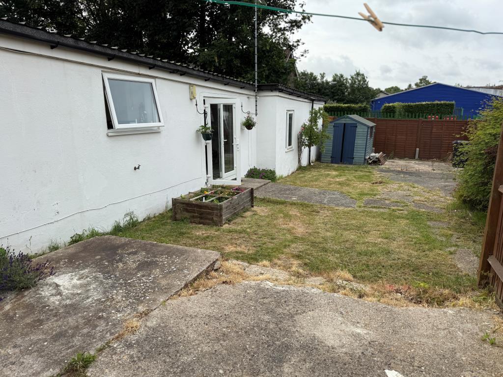 View of rear elevation showing garden and shed