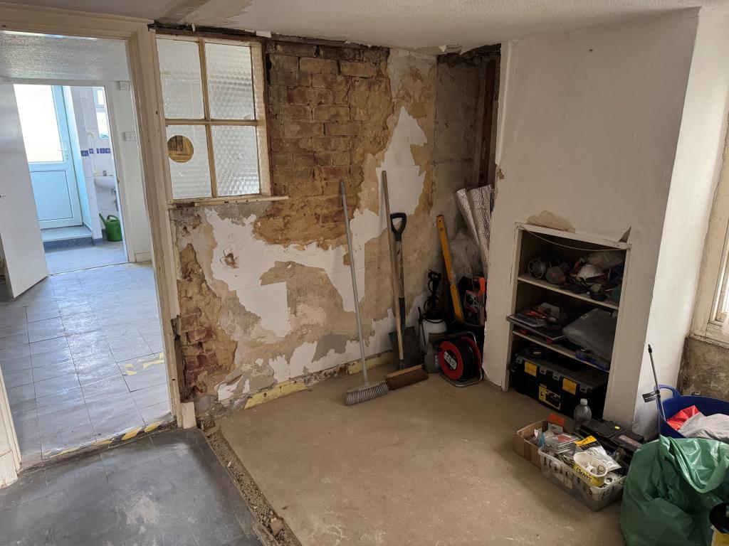The Rear Reception Room and Kitchen Beyond