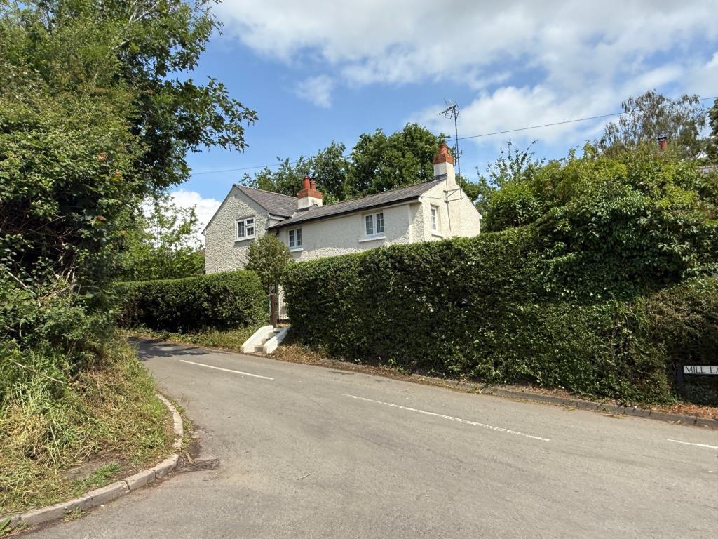 External photo showing the dwelling from roadside
