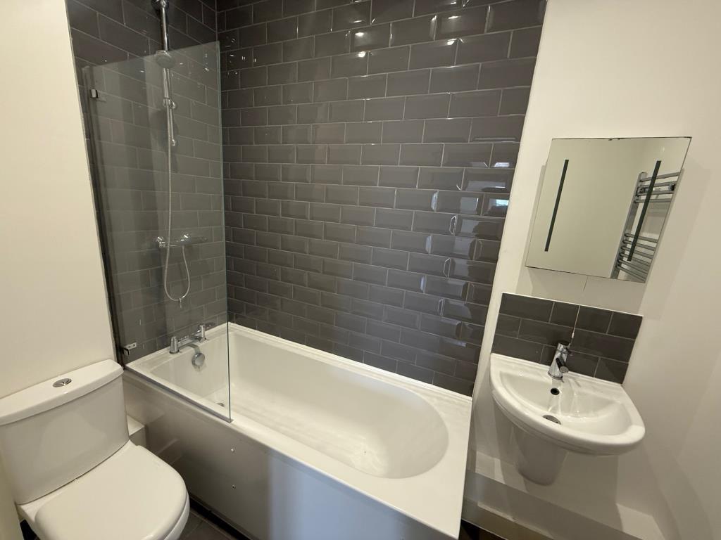 Bathroom with modern fitted bathroom suite and gre