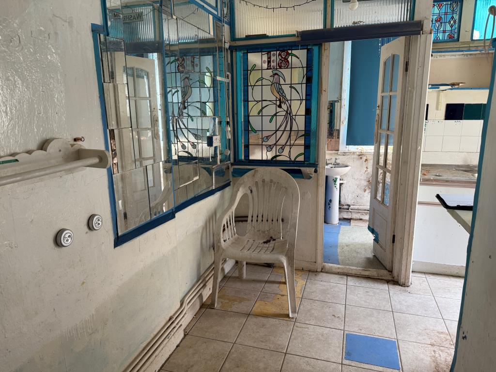 Kitchen area with door to bathroom
