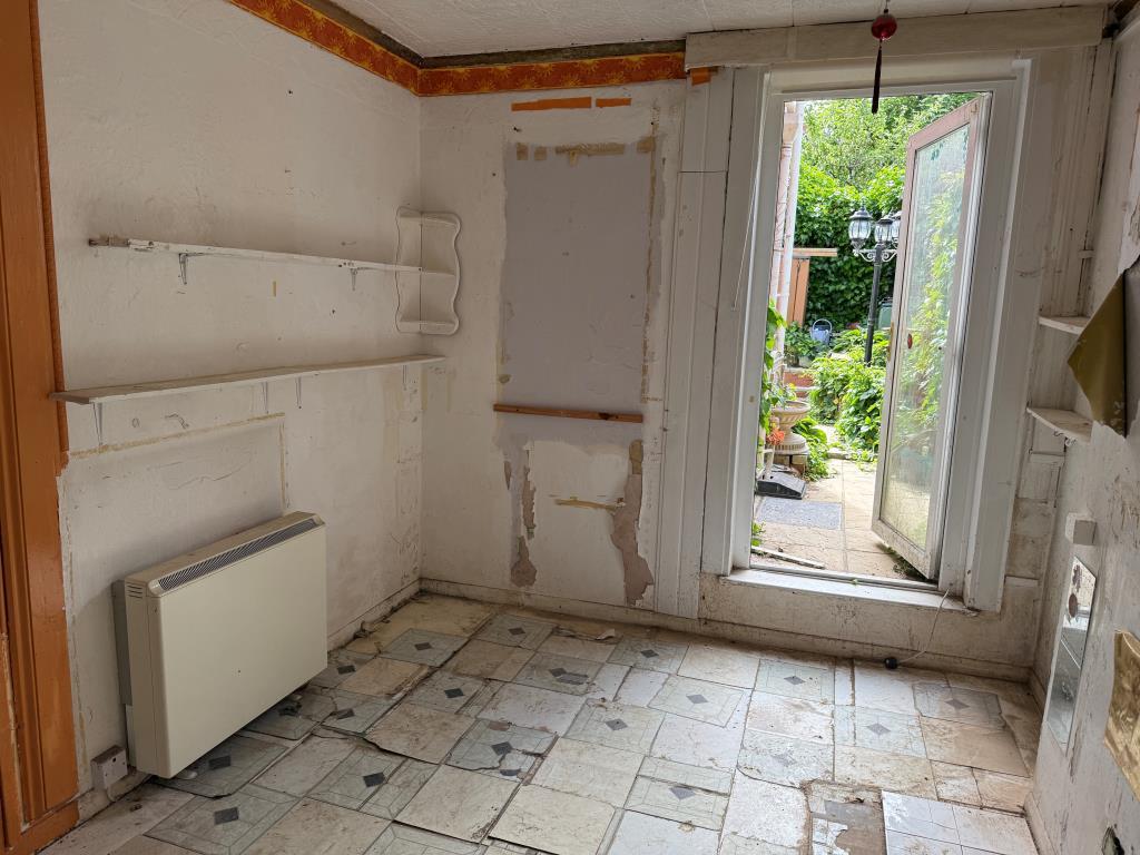 Studio living area with door to rear patio