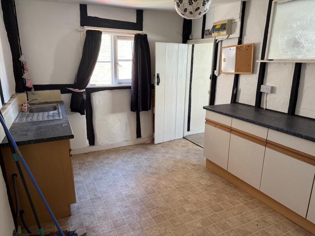 View of kitchen with twindow and fitted units