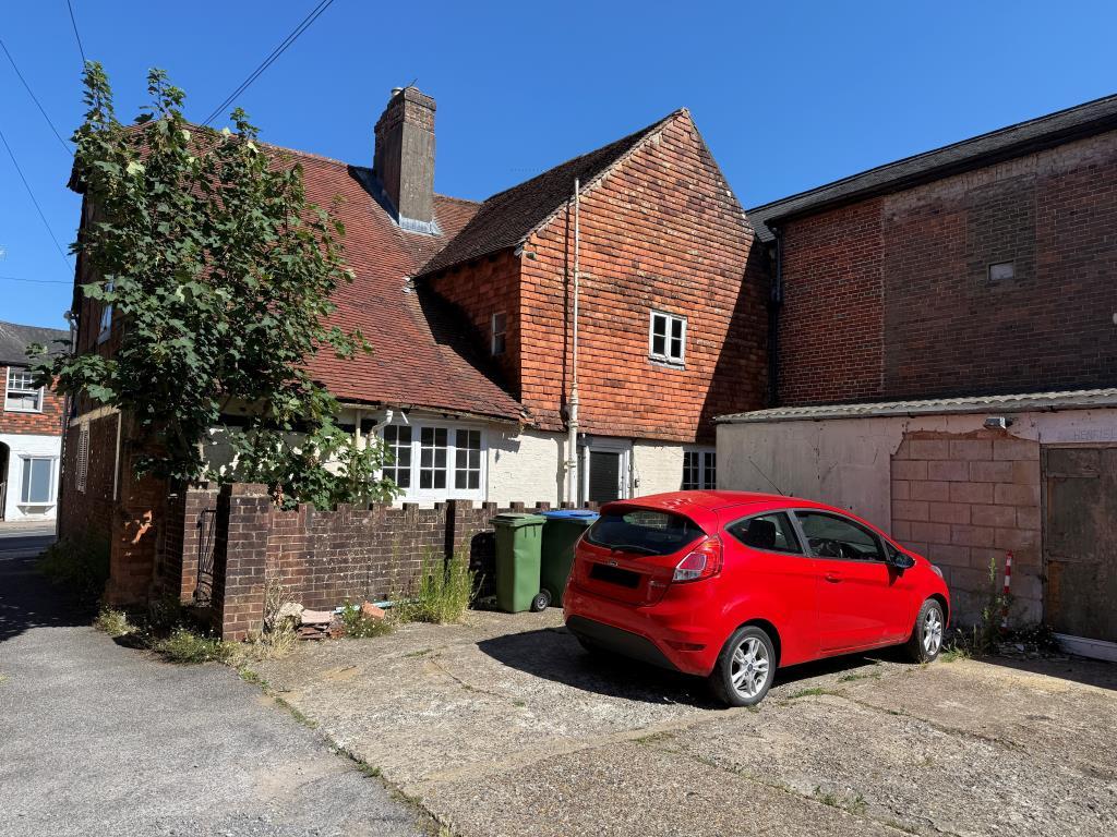 Rear elevation of property with parking area