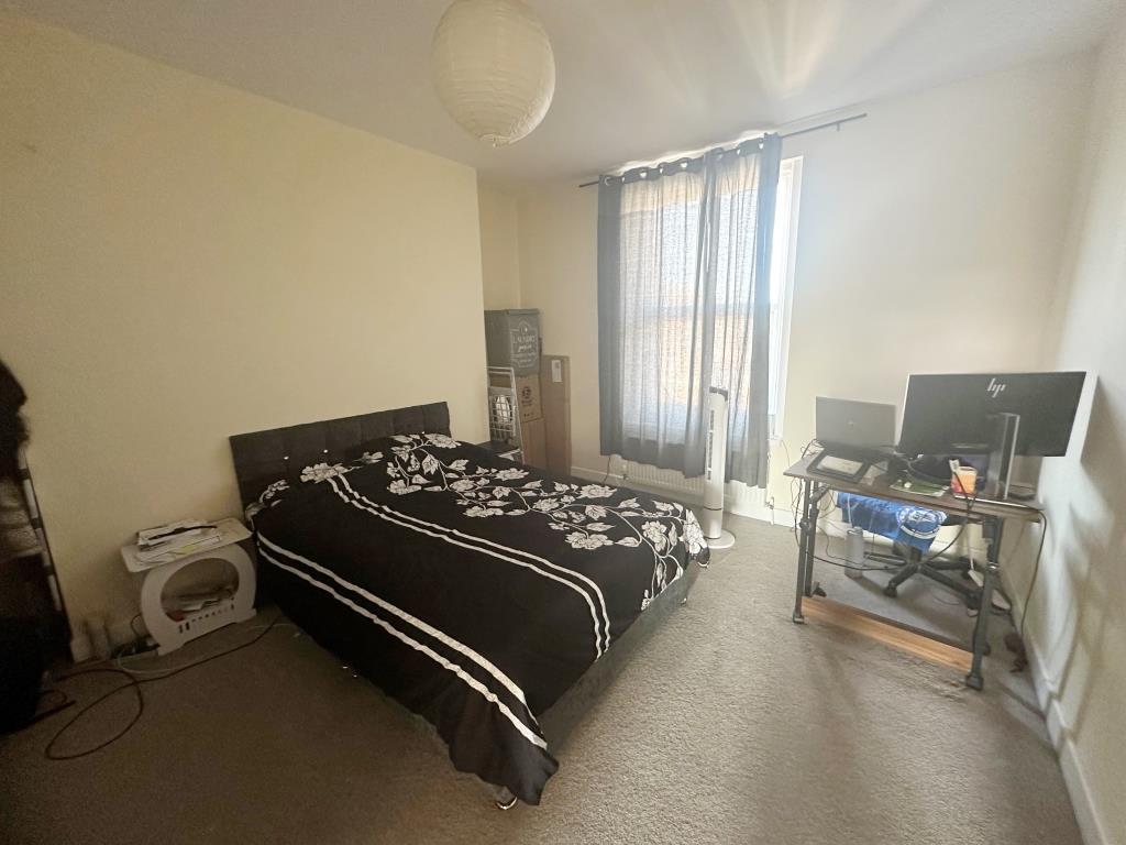 Top floor flat bedroom