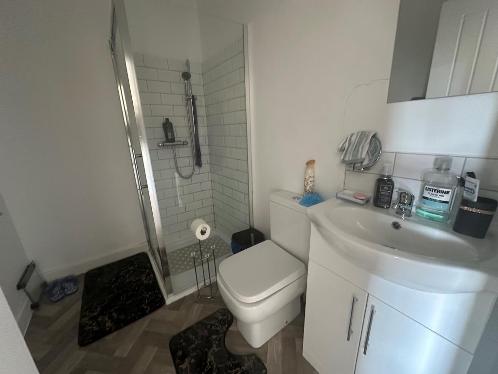 Top floor flat shower room with W.C.