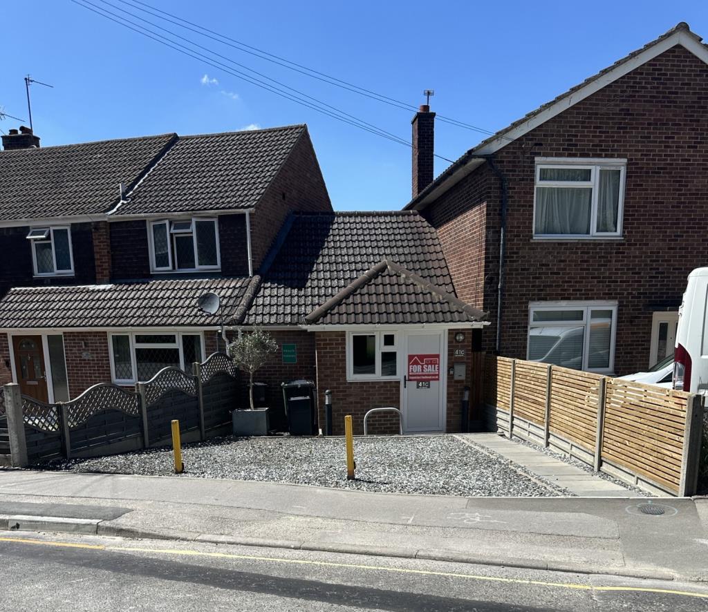 Front of property with driveway