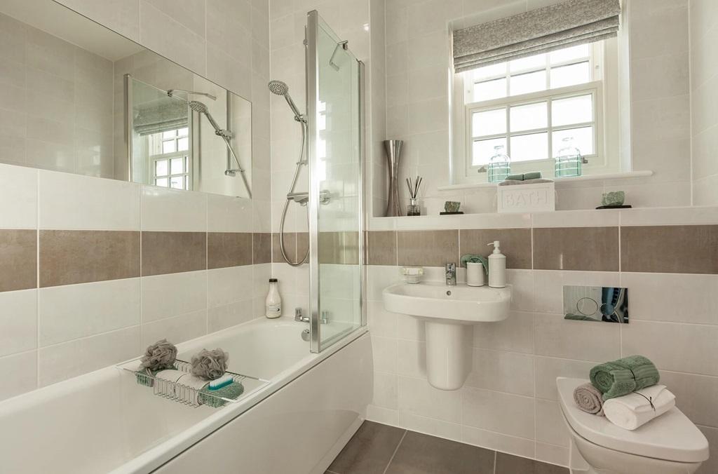 A main bathroom with high quality fixtures and...