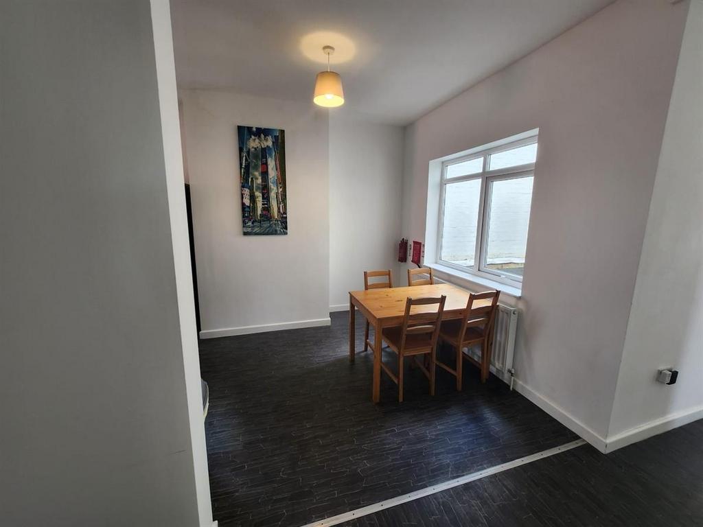 Bright eat-in kitchen with a window providing n...