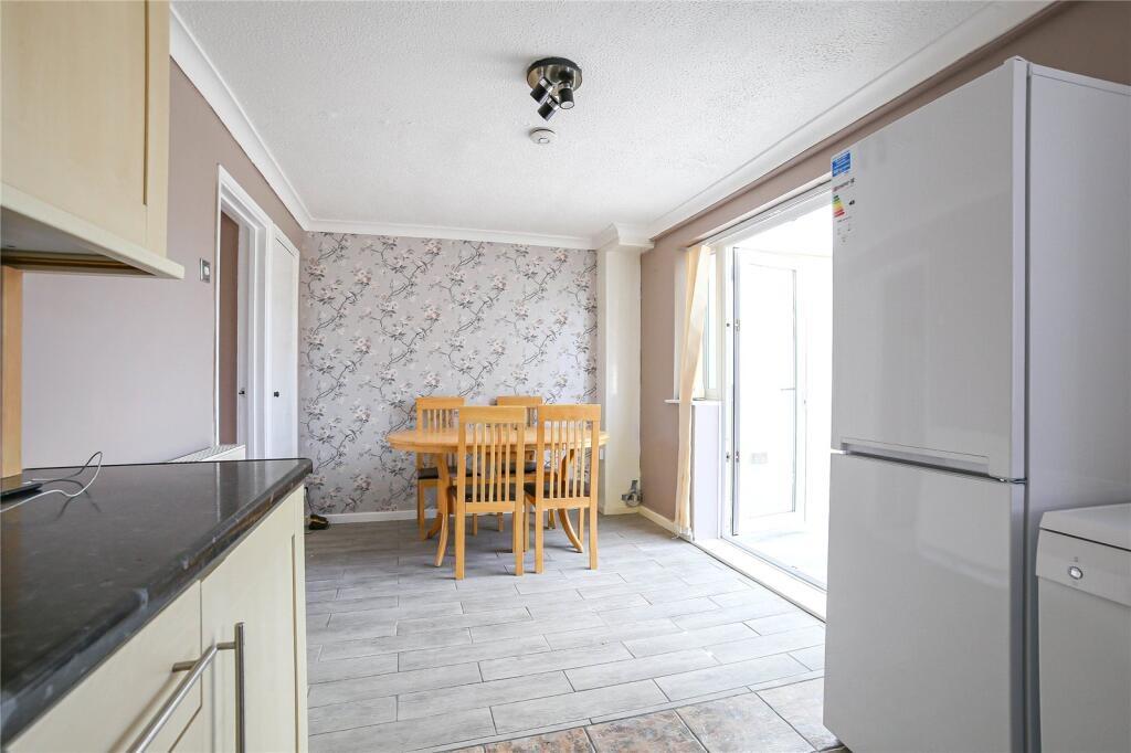 Bright and airy kitchen space with natural ligh...