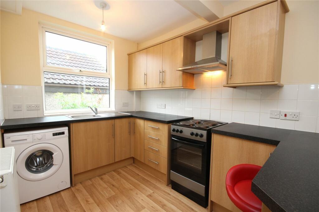 A bright and inviting kitchen featuring modern ...