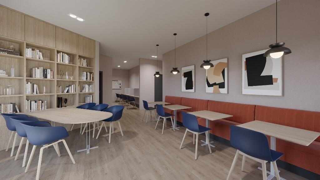 A modern communal lounge featuring stylish pend...