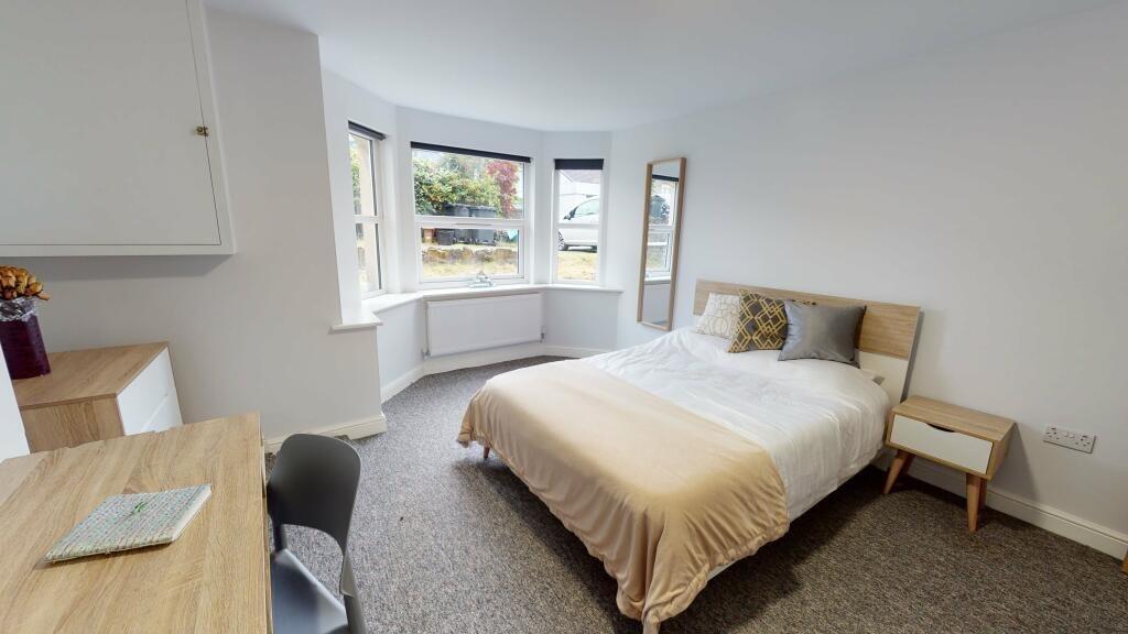 Bright and inviting double bedroom featuring a ...