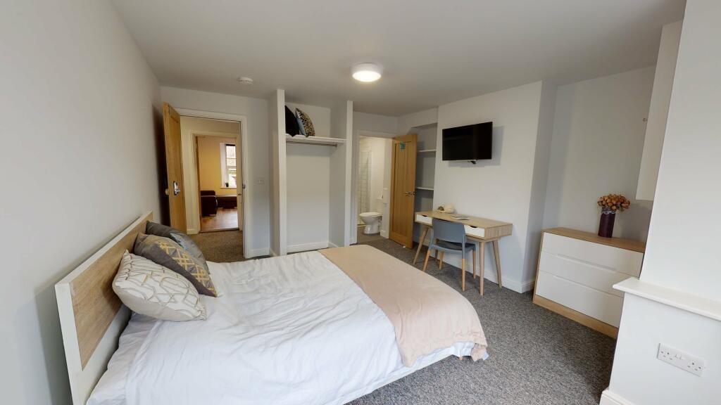 Bright and inviting double bedroom featuring a ...