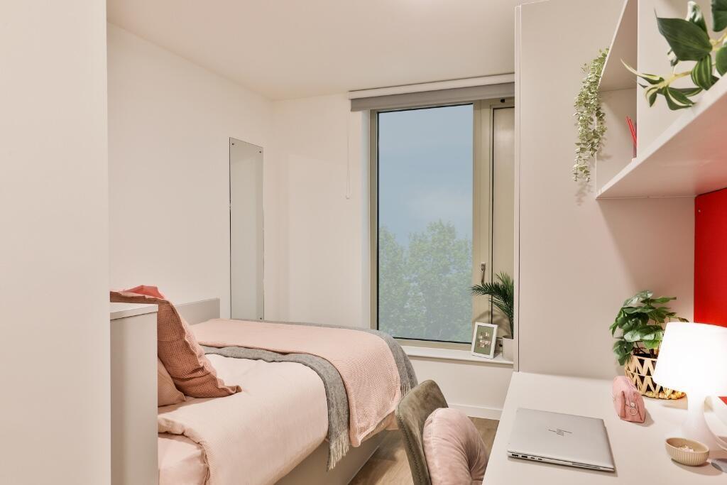 A bright and welcoming single bedroom featuring...