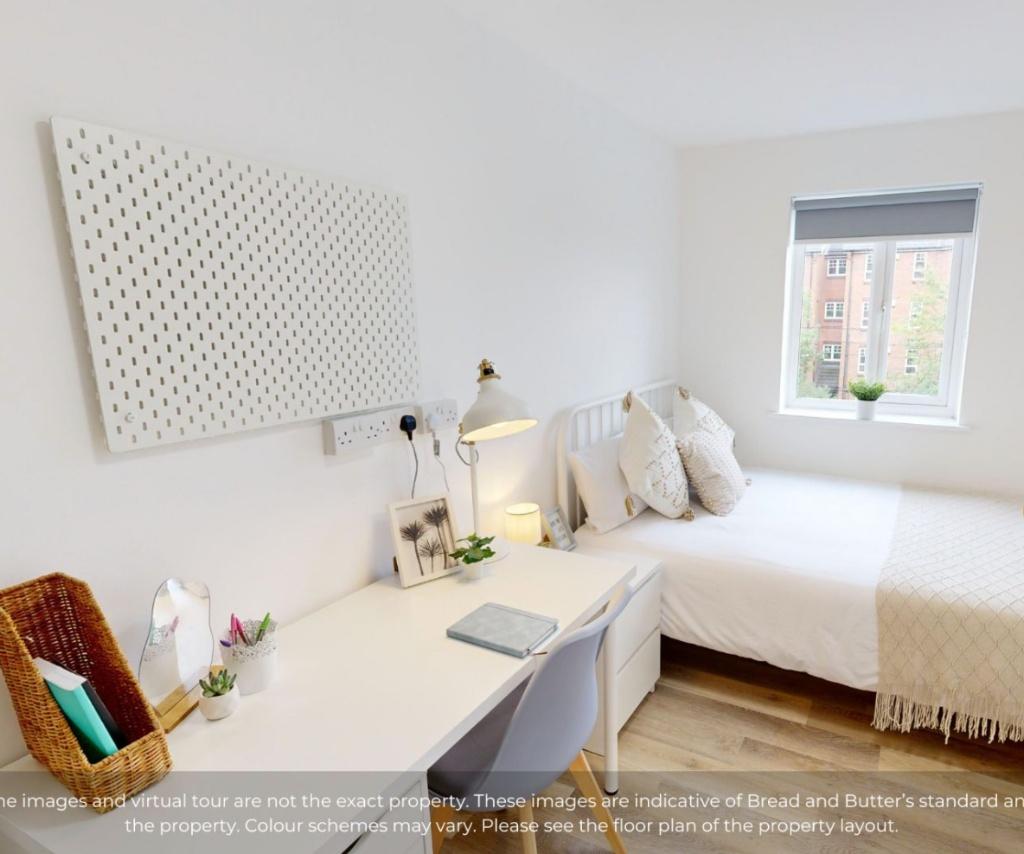 A bright and tidy single bedroom featuring a co...