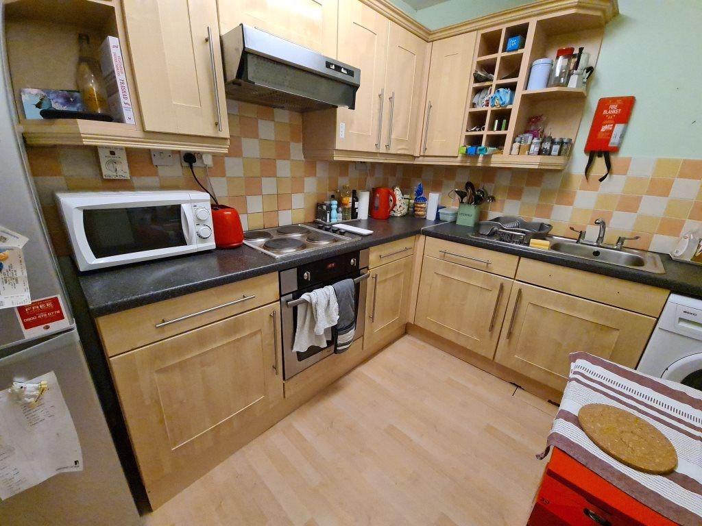 Bright and functional kitchen space featuring a...