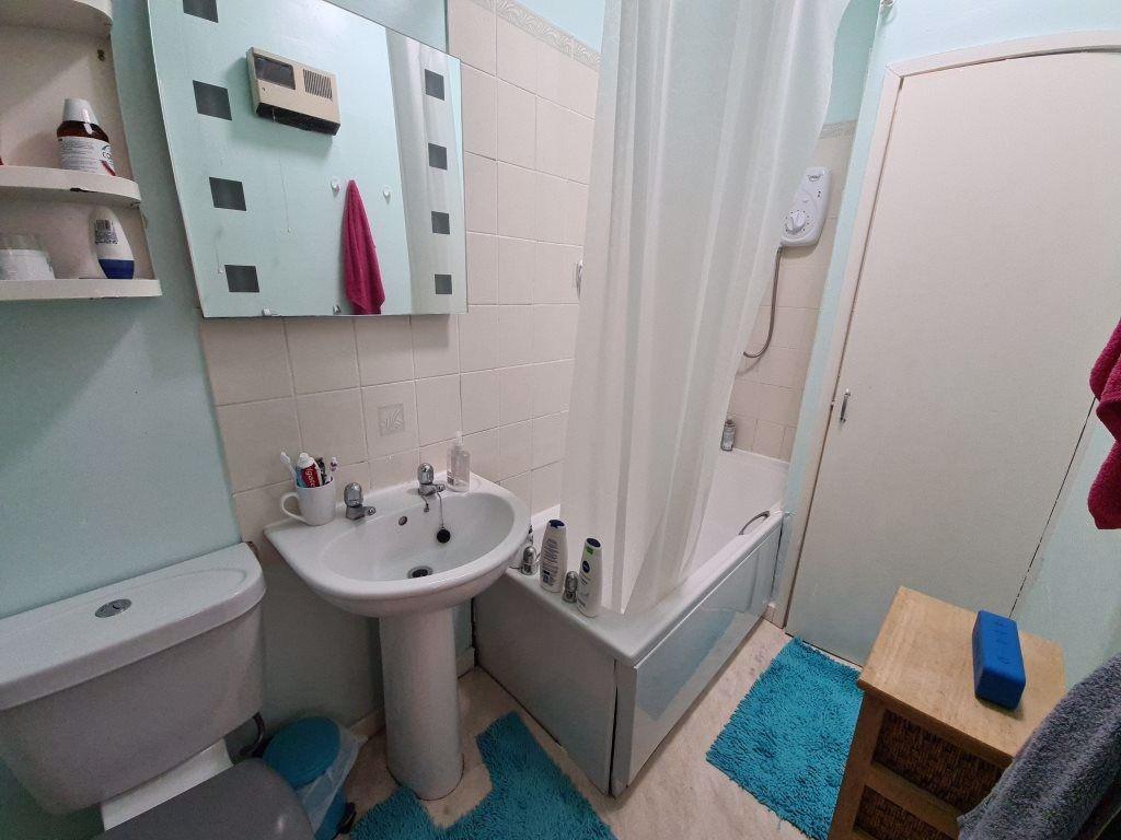 A clean and well-maintained bathroom featuring ...