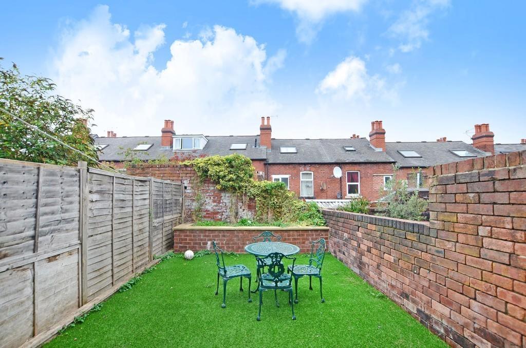 A bright and well-maintained garden space featu...