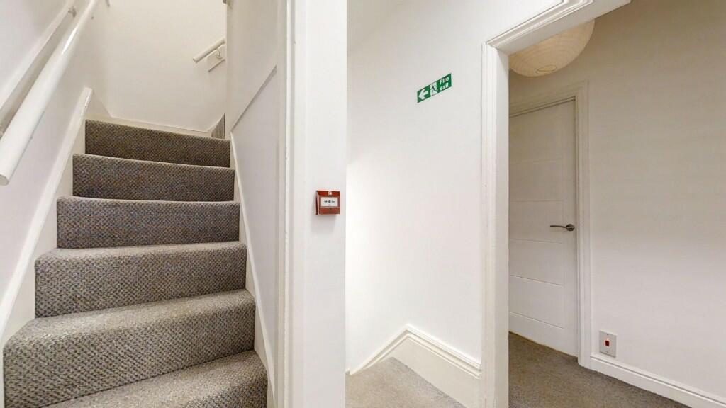 A clean and well-maintained staircase area with...