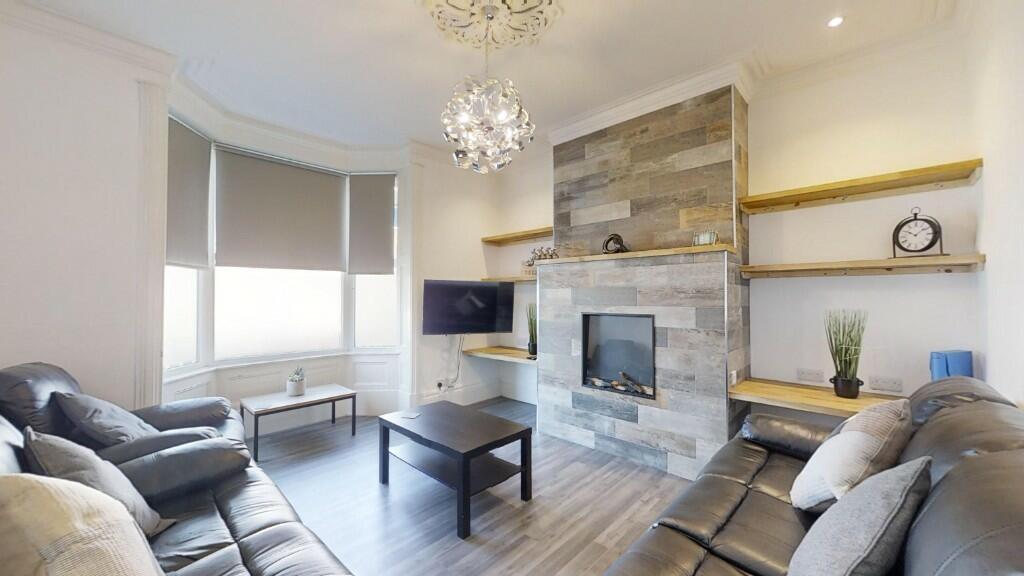 A stylish contemporary living room featuring co...