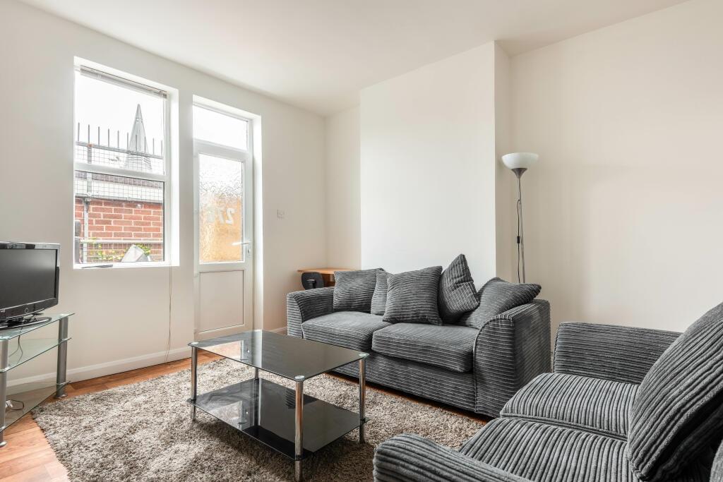 Bright and contemporary living room featuring c...