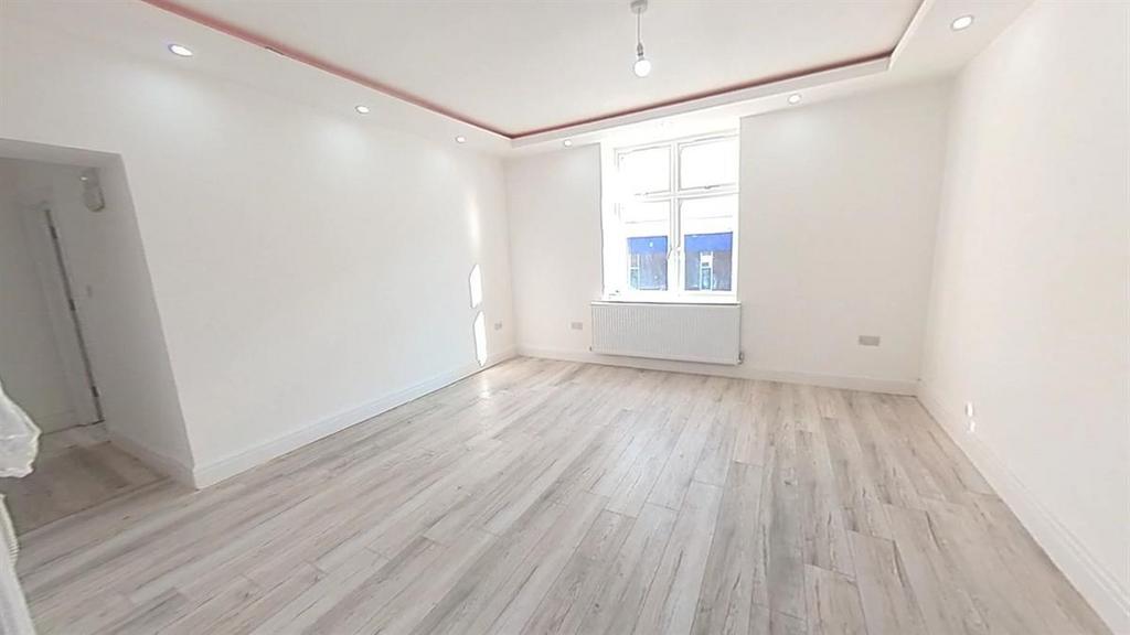 A bright and spacious master bedroom featuring ...