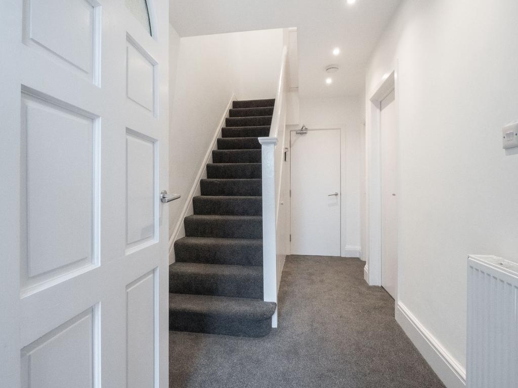 Welcoming hallway featuring modern decor, well-...