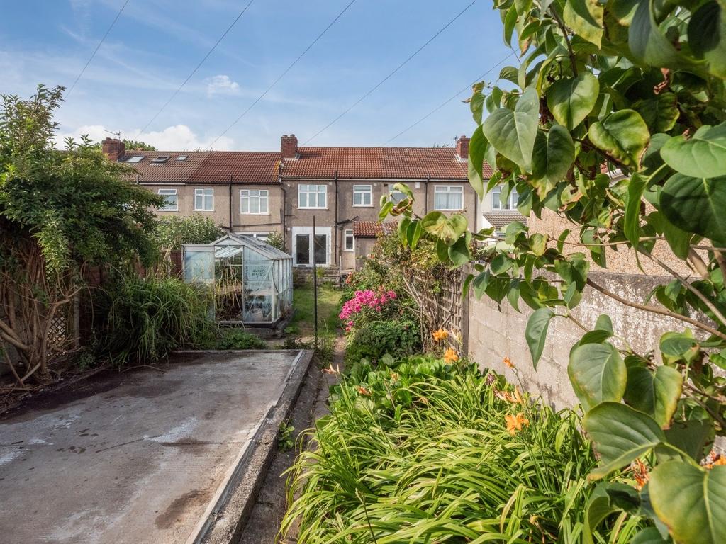 A charming garden space featuring vibrant flowe...