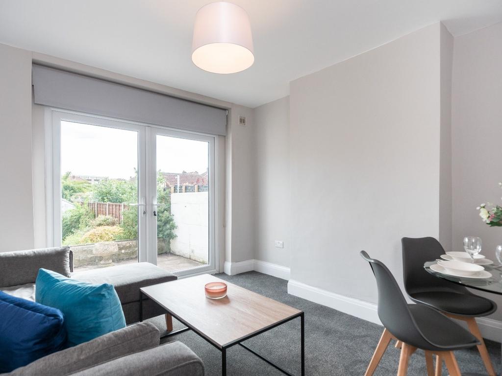 This contemporary living room features a cozy s...