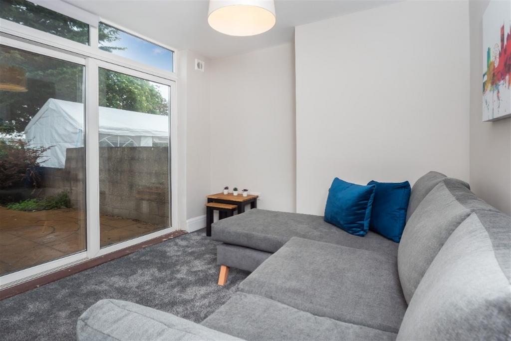 Bright and inviting living room featuring a com...
