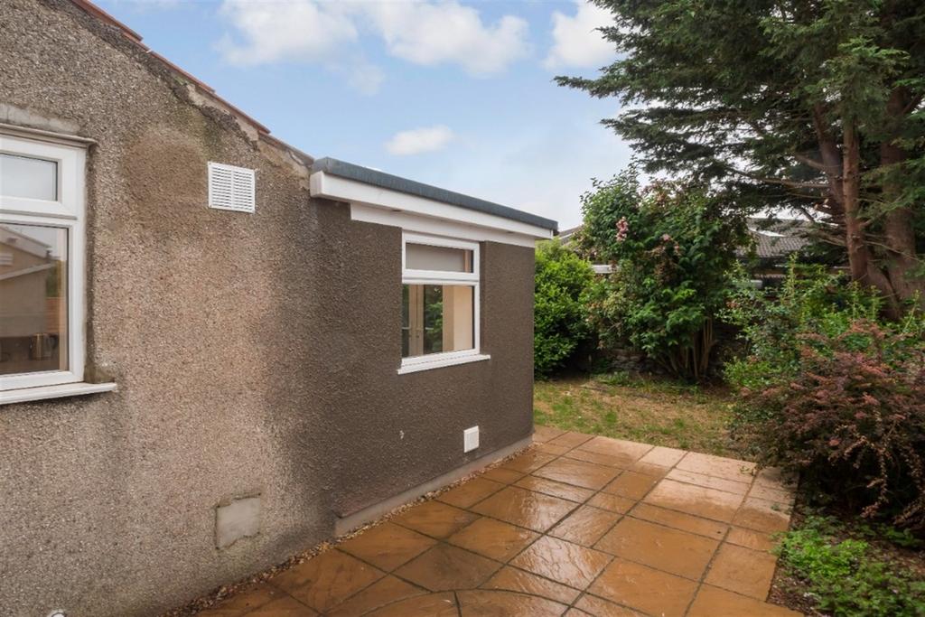 A well-maintained garden area featuring a spaci...