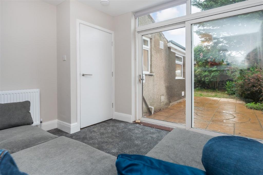 Bright and tidy living room featuring a comfort...