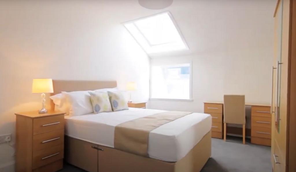Bright and cozy double bedroom featuring a comf...